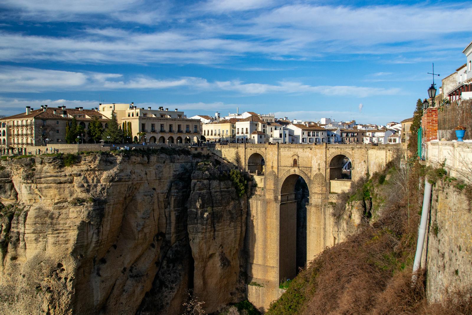 Dramatic view of Puente Nuevo bridge spanning a gorge in Ronda, Spain.